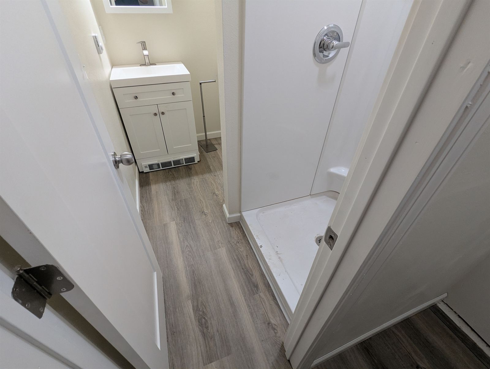 Bathroom with a walk-in shower and vanity in Unit 2
