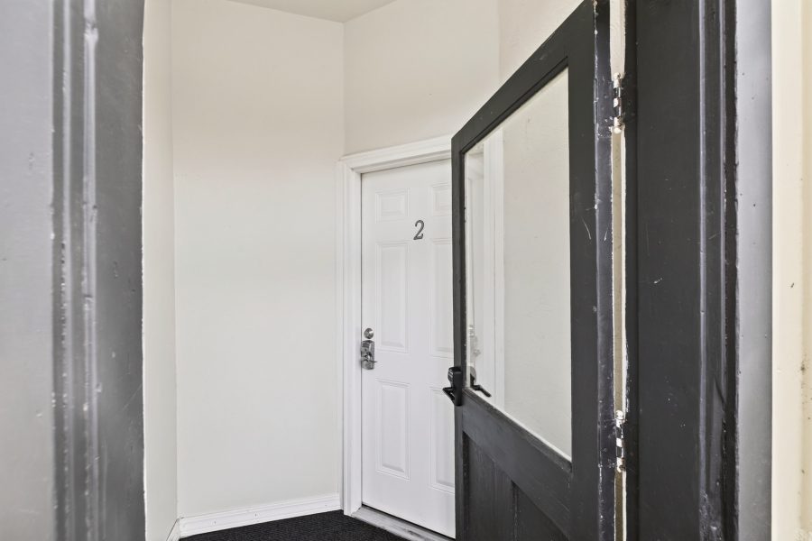 The private entry door to Unit 2, off the building's interior hallway