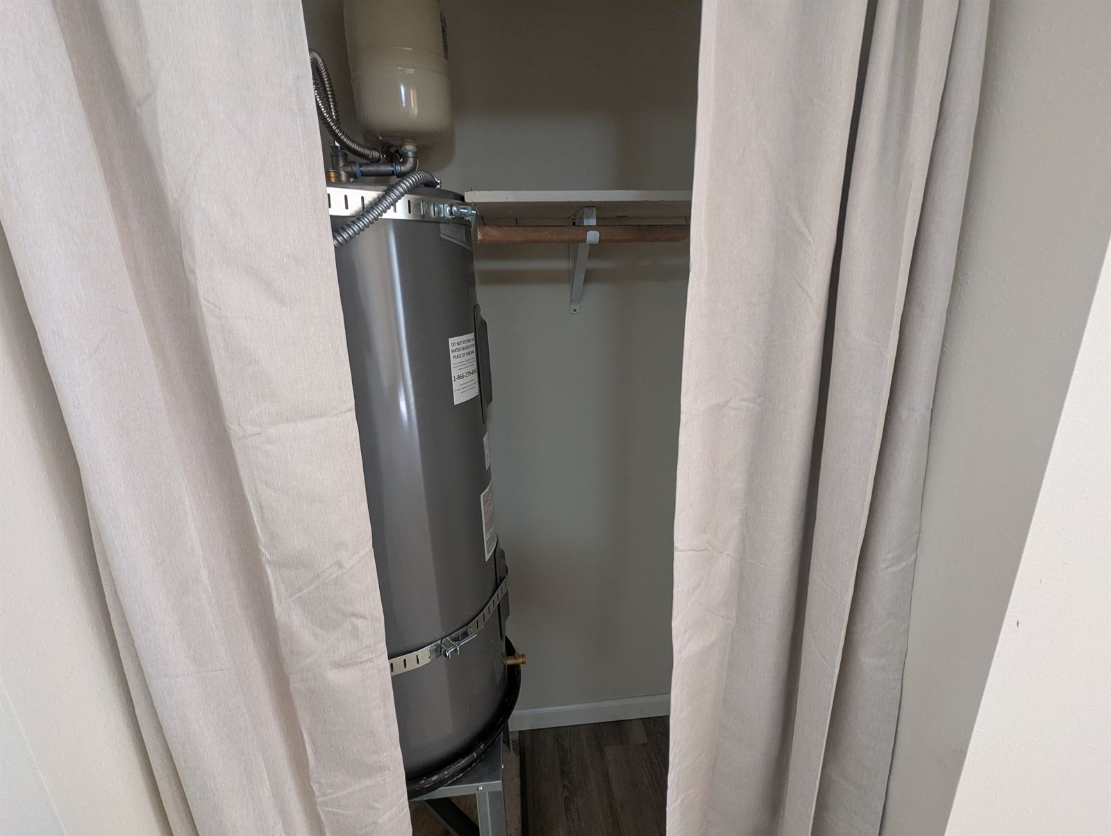 Utility closet with the water heater in Unit 2
